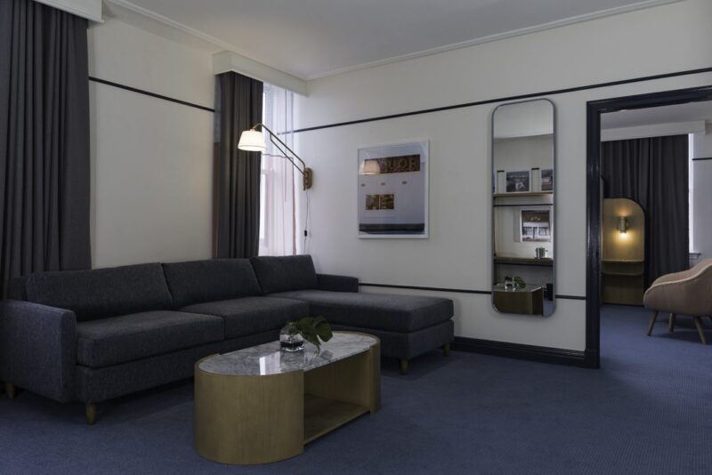 Living area of one of our Memphis hotel suites decorated in gray