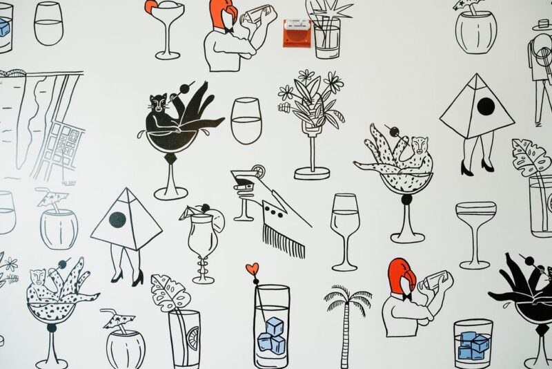 Whimsical, cocktail-based line art on a wall at our Memphis hotel