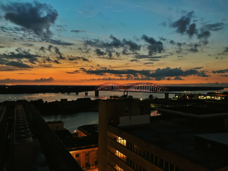 View of the sunset behind a bridge from our downtown Memphis hotel