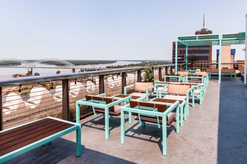 Mint green framed chairs on the roof of our Memphis hotel overlooking the Mississippi river